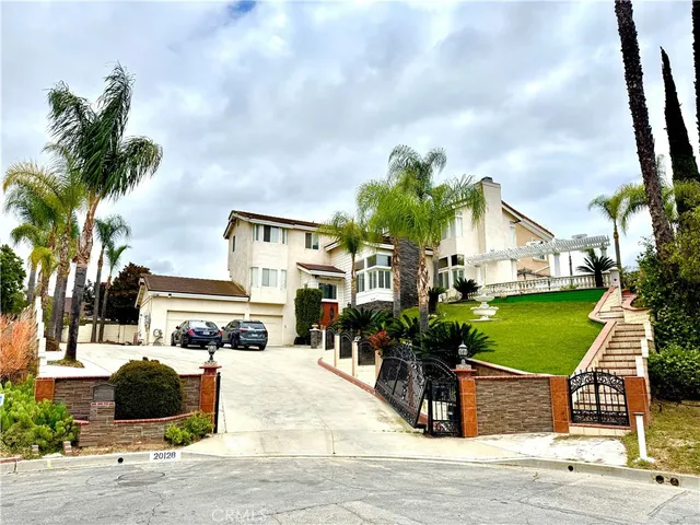 a view of multiple house with a yard and street view