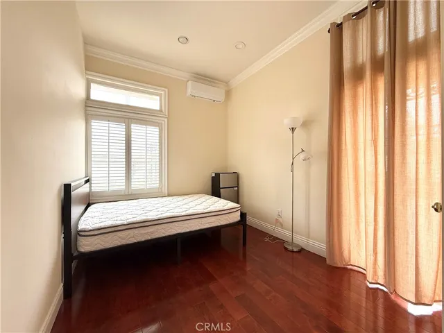 a room with a bed and a window