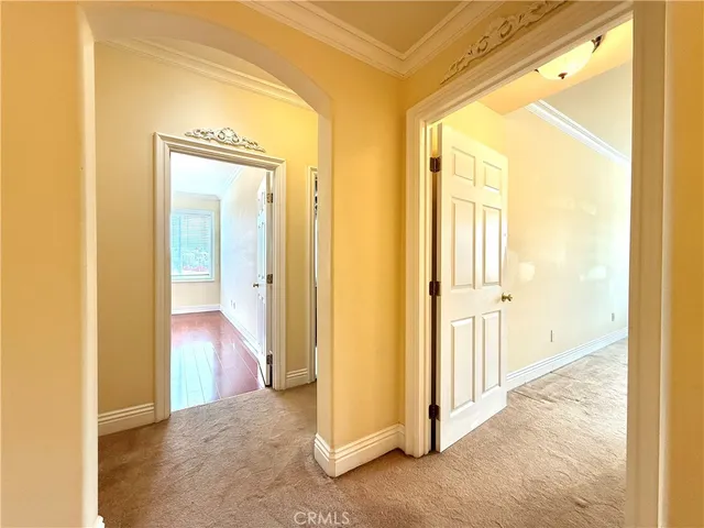 a view of a bathroom from a hallway
