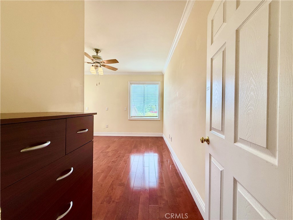 20128 Candleflame Court Walnut, CA 91789 - Photo 37 of 46 a view of a hallway with wooden floor and staircase
