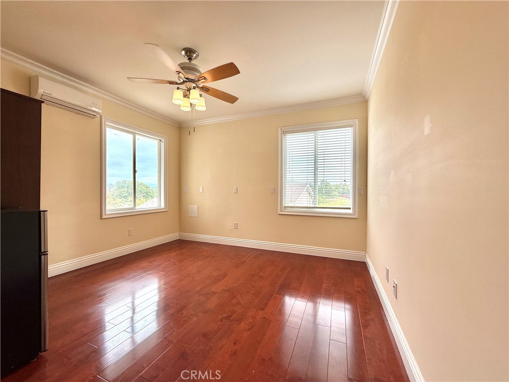20128 Candleflame Court Walnut, CA 91789 - Photo 38 of 46 a view of empty room with wooden floor and fan