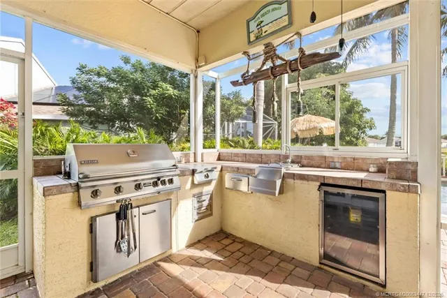a view of a kitchen with a stove top oven
