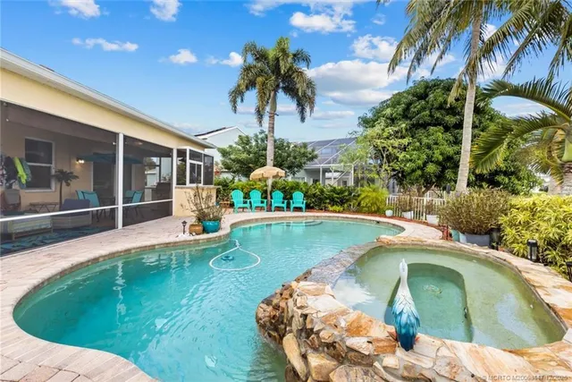 a view of a swimming pool with a patio