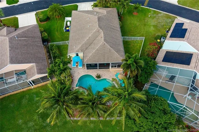 an aerial view of a house with a garden and plants