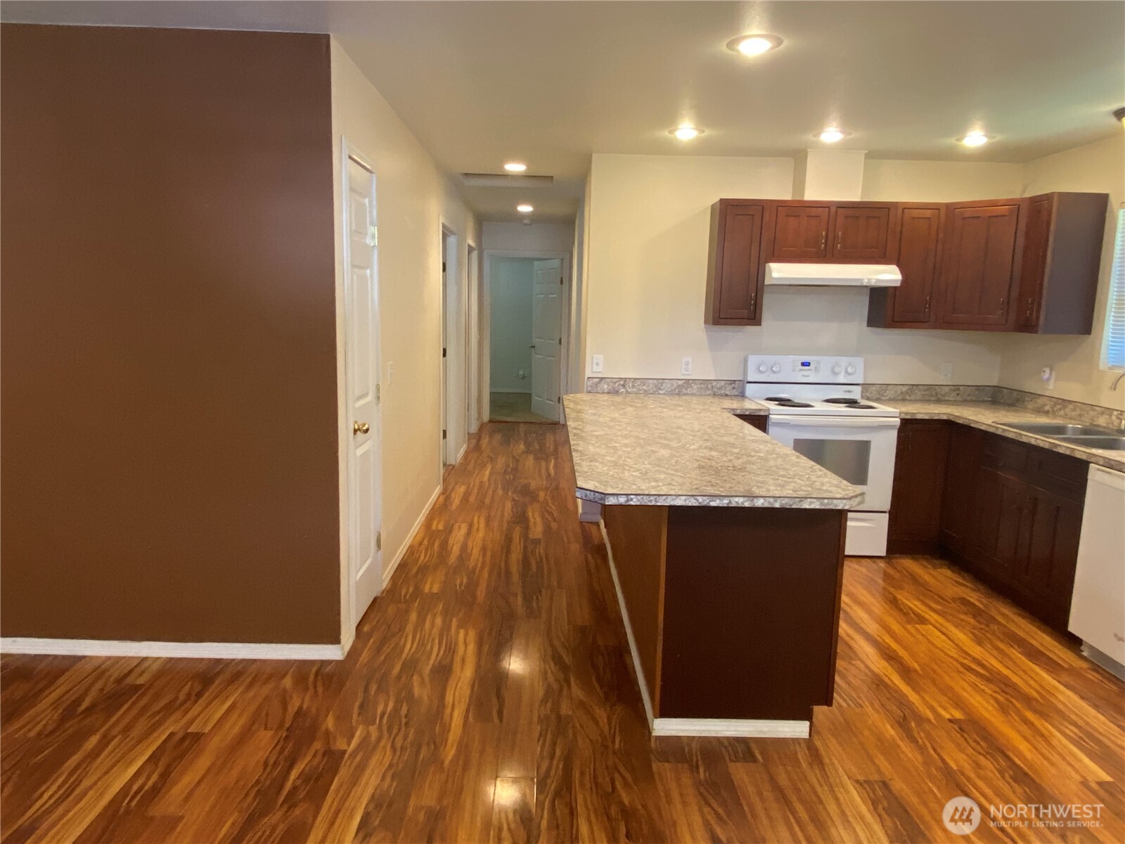 320 C Street South Bend, WA 98586 - Photo 5 of 25 a kitchen with a sink and a wooden floor
