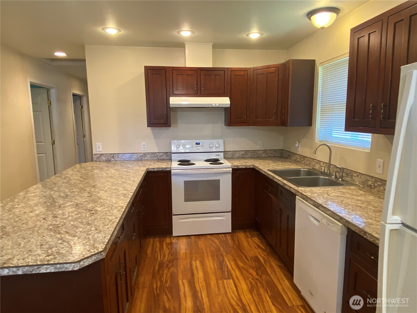 320 C Street South Bend, WA 98586 - Photo 8 of 25 a kitchen with a sink stove and refrigerator