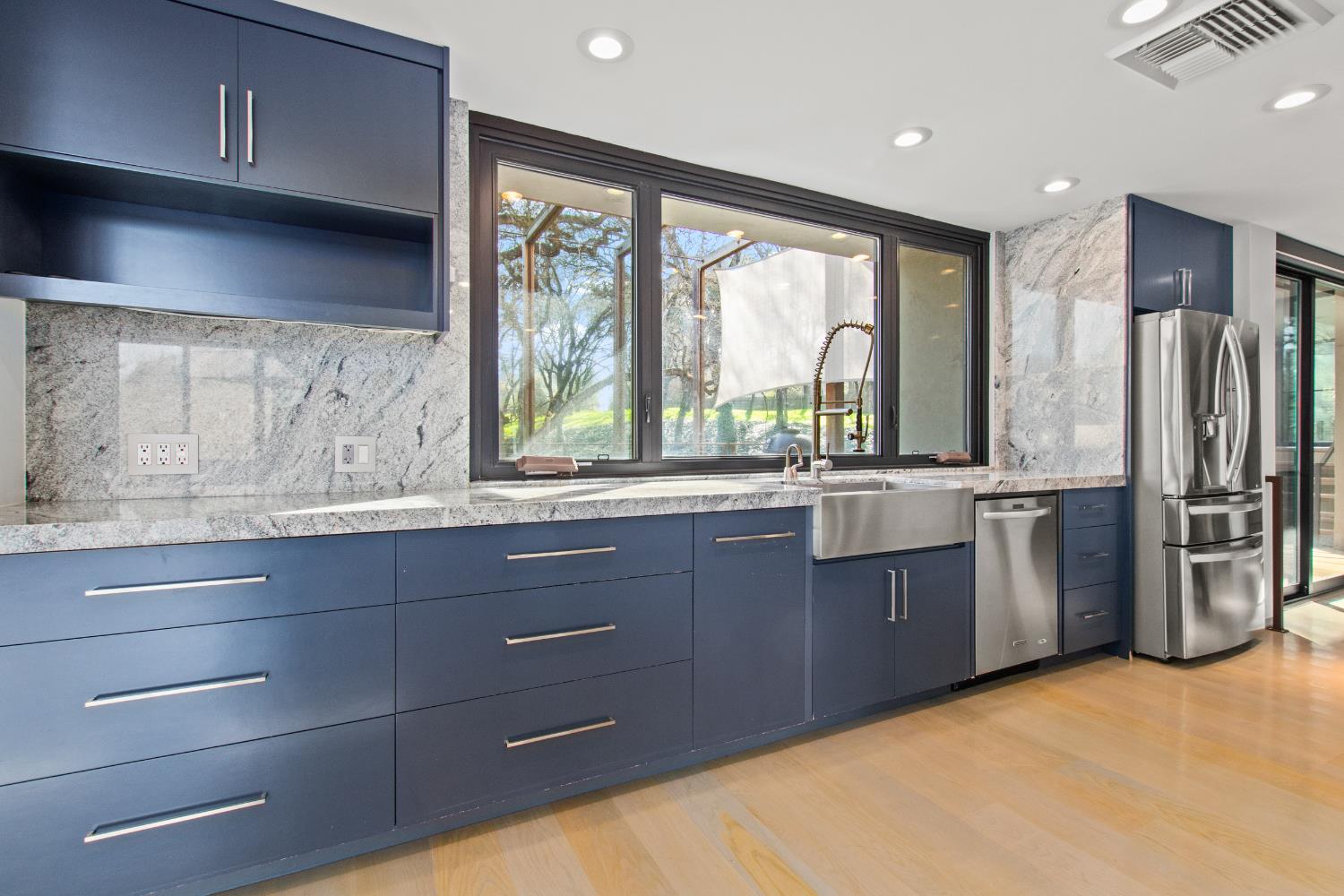 12100 Horseshoe Road Oakdale, CA 95361 - Photo 26 of 77 a kitchen with stainless steel appliances granite countertop a stove and a refrigerator