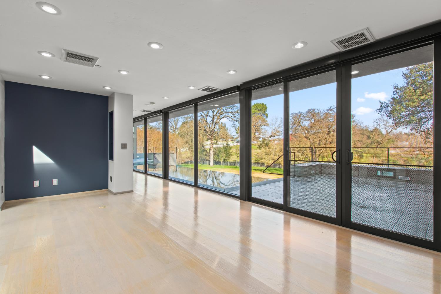 12100 Horseshoe Road Oakdale, CA 95361 - Photo 29 of 77 a view of an empty room with large windows