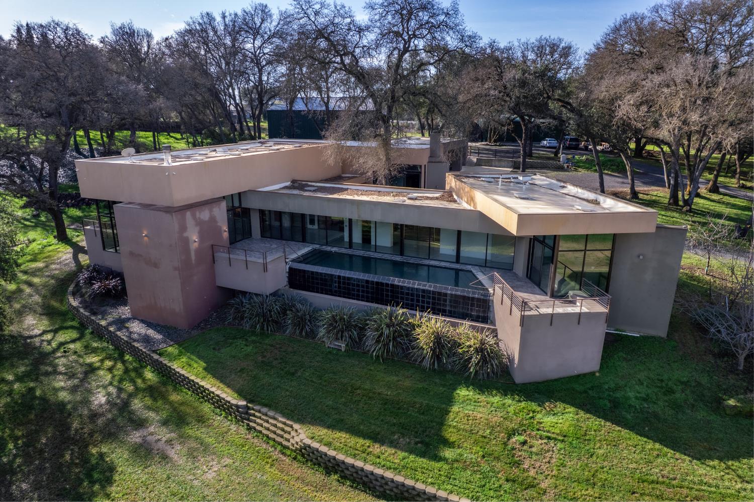 12100 Horseshoe Road Oakdale, CA 95361 - Photo 4 of 77 a view of a house with a big yard and large trees