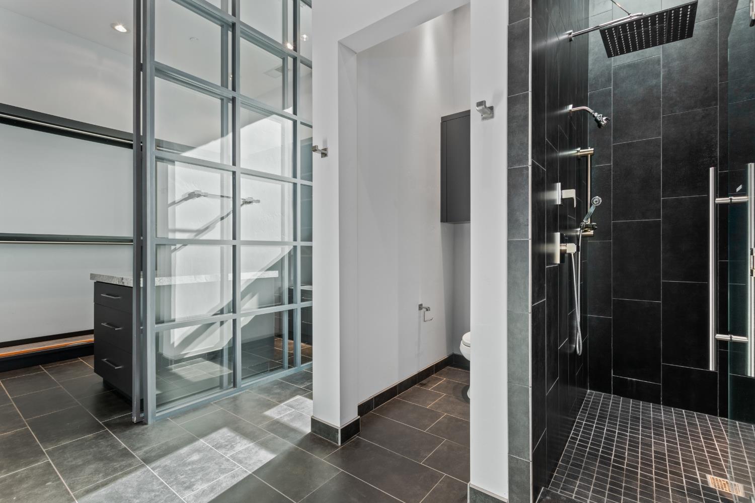 12100 Horseshoe Road Oakdale, CA 95361 - Photo 44 of 77 a bathroom with a glass shower door