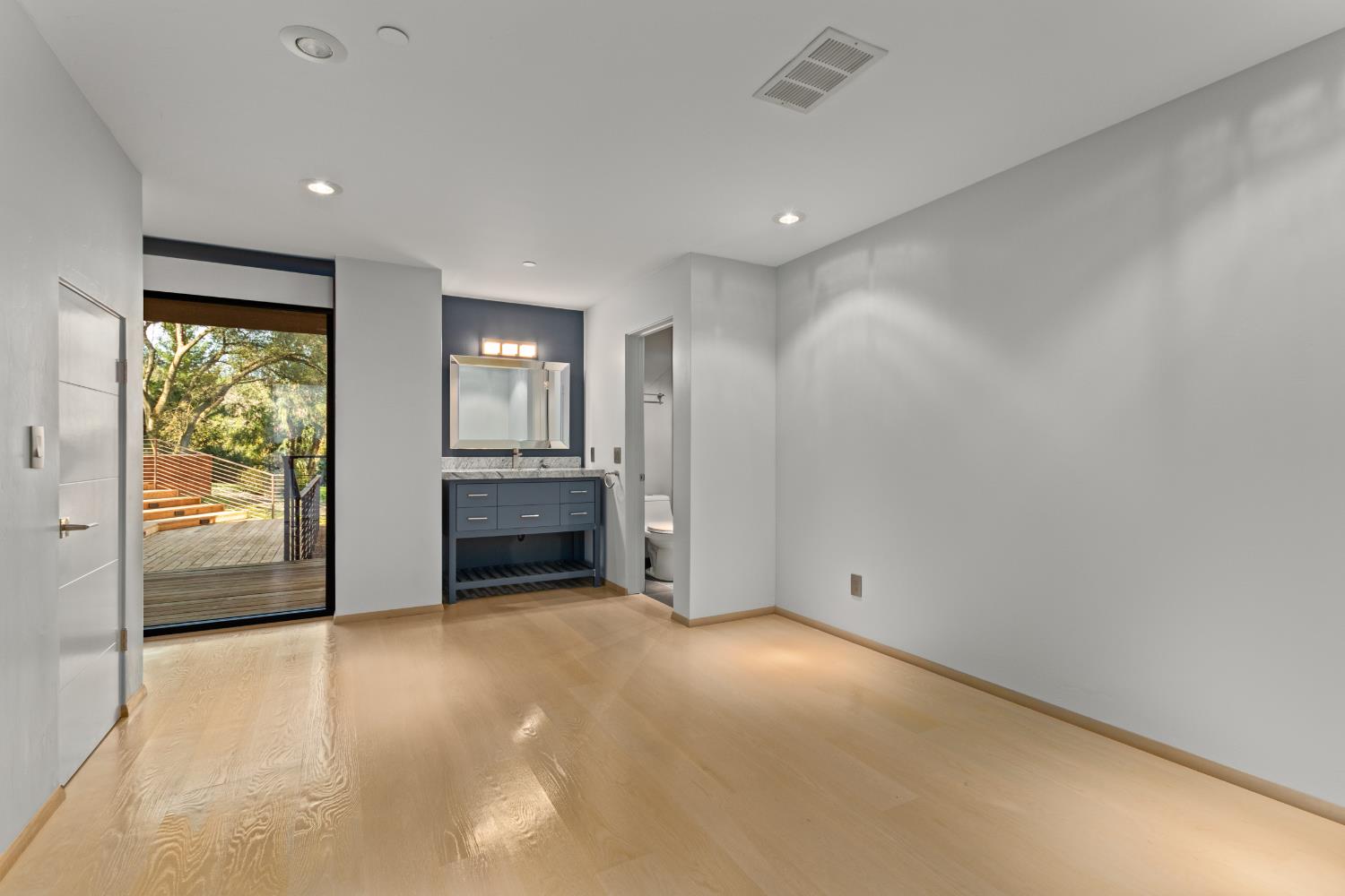 12100 Horseshoe Road Oakdale, CA 95361 - Photo 46 of 77 a view of an empty room with a fireplace and a window