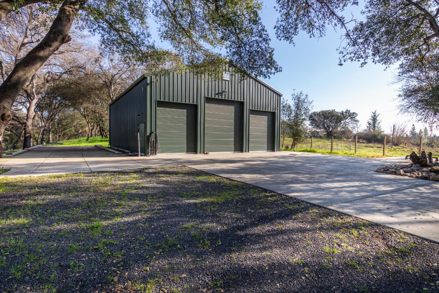 12100 Horseshoe Road Oakdale, CA 95361 - Photo 69 of 77 a front view of a house with a yard