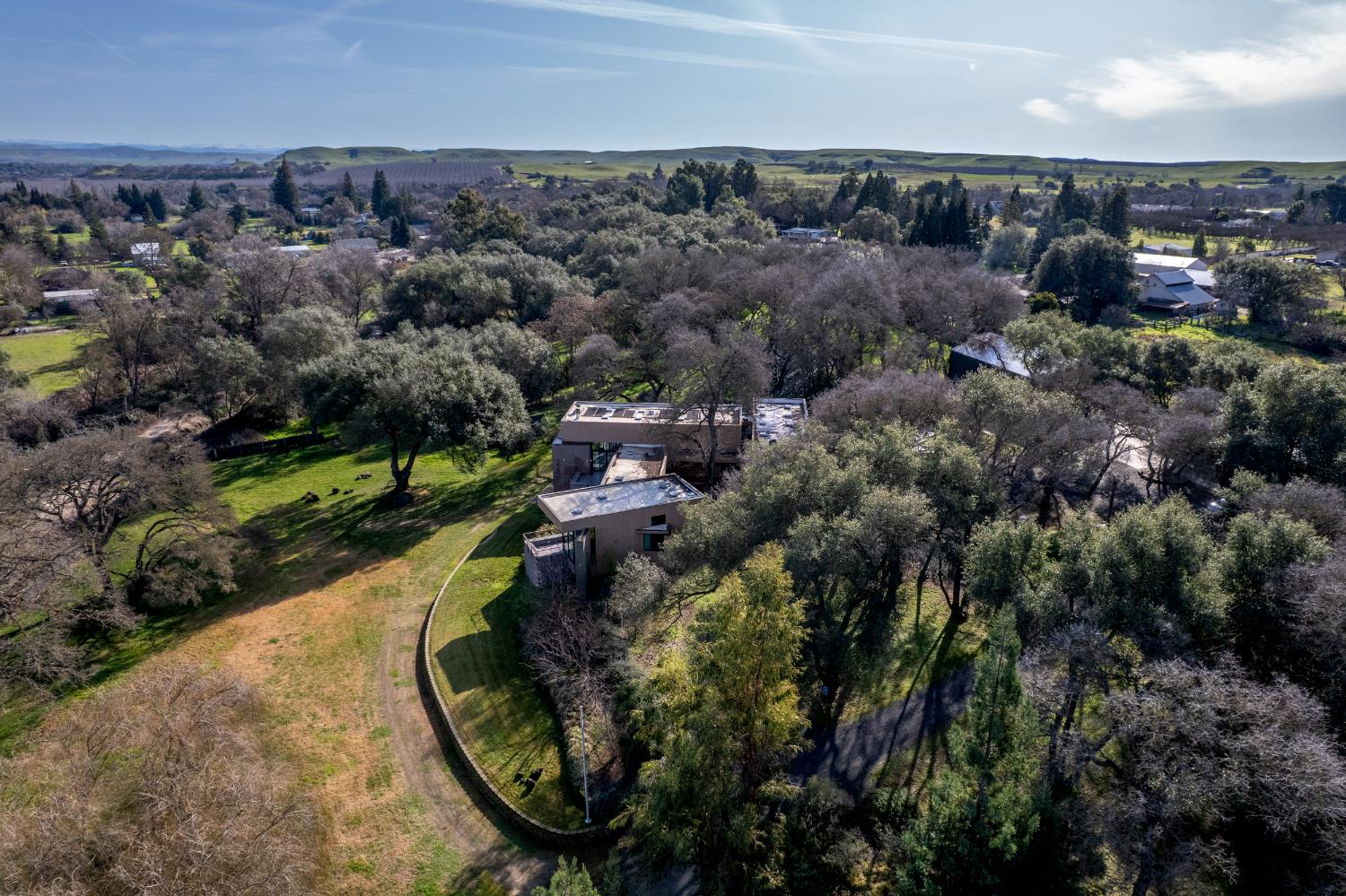 12100 Horseshoe Road Oakdale, CA 95361 - Photo 76 of 77 an aerial view of a house with a yard and lake view
