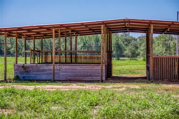 a view of a yard with wooden floor and outdoor seating