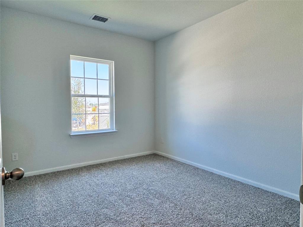 1919 Aleia Cove Sherman, TX 75092 - Photo 25 of 32 an empty room with a window