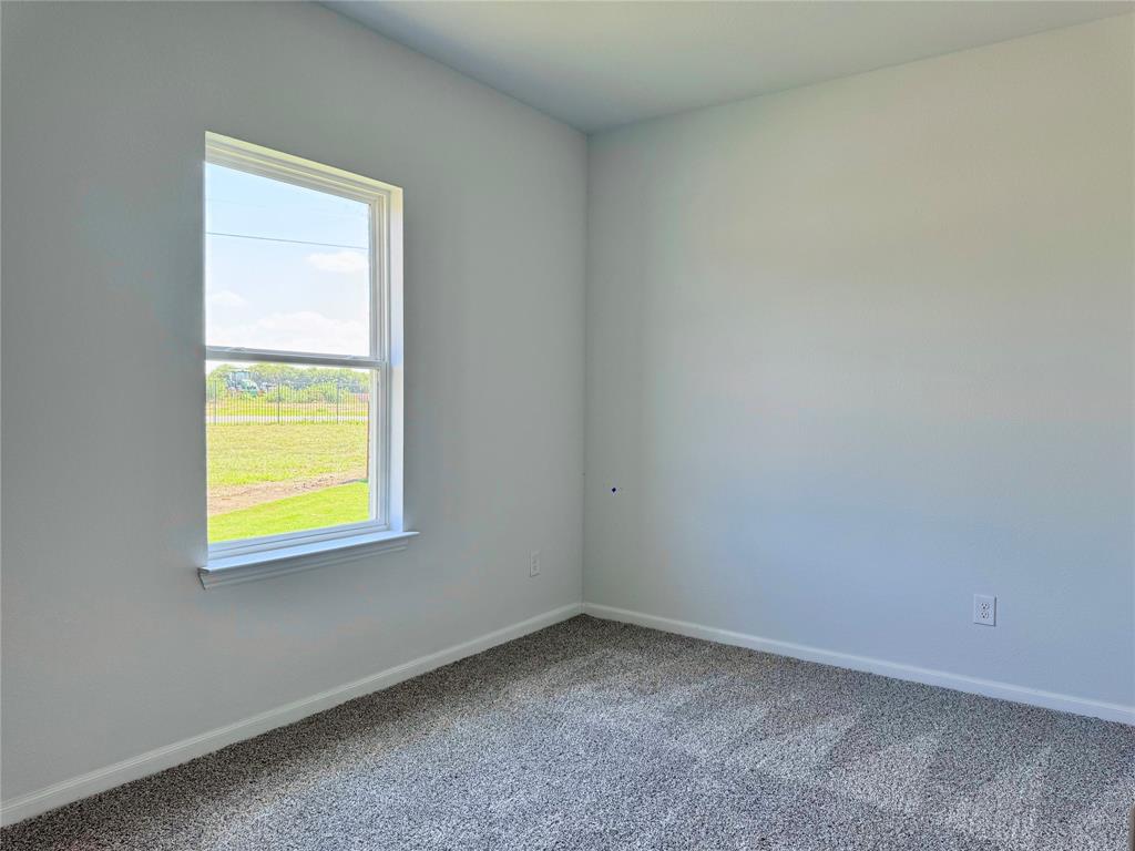 1919 Aleia Cove Sherman, TX 75092 - Photo 26 of 32 an empty room with a window