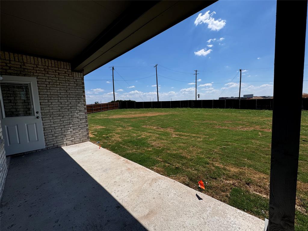 1919 Aleia Cove Sherman, TX 75092 - Photo 29 of 32 a view of a kitchen with wooden floor