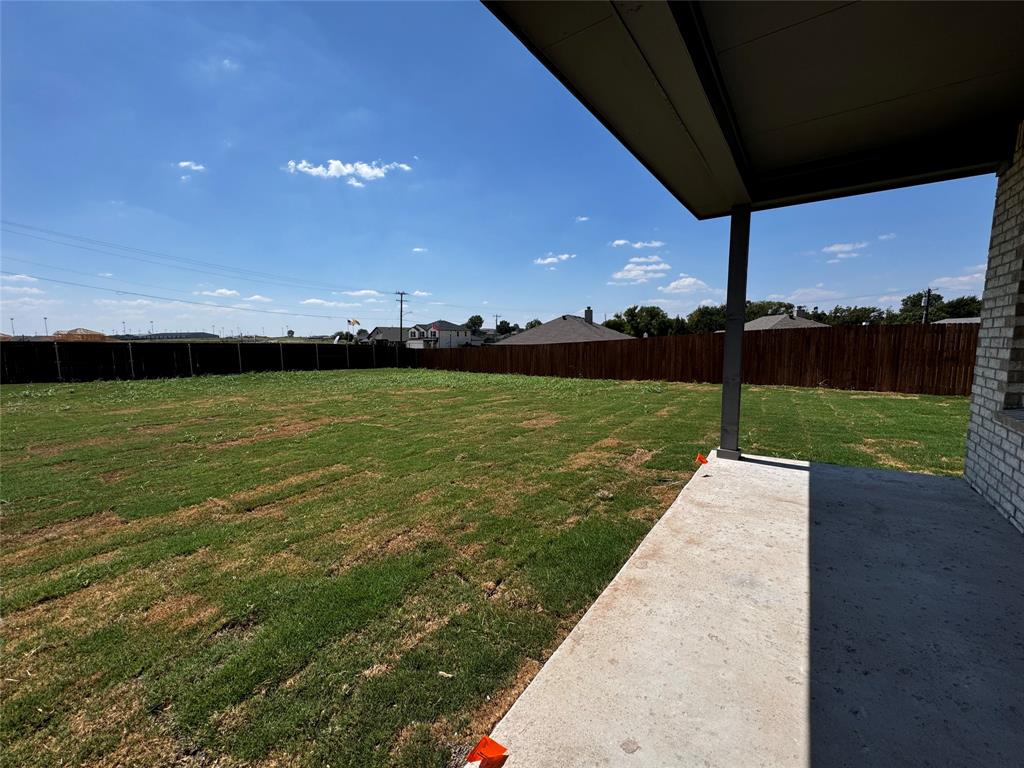 1919 Aleia Cove Sherman, TX 75092 - Photo 31 of 32 a view of a lake with a big yard