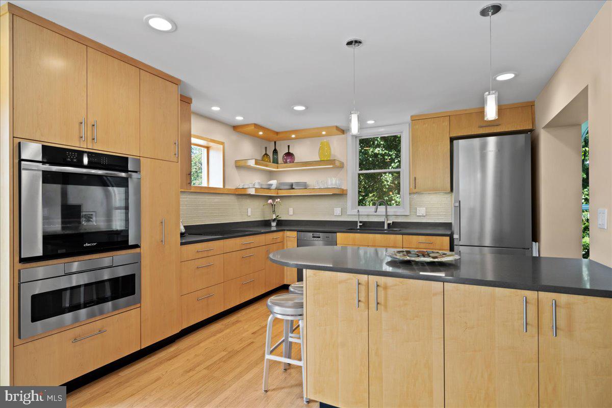 60 Humbert Street Princeton, NJ 08542 - Photo 16 of 44 a kitchen with stainless steel appliances granite countertop a refrigerator and a stove top oven