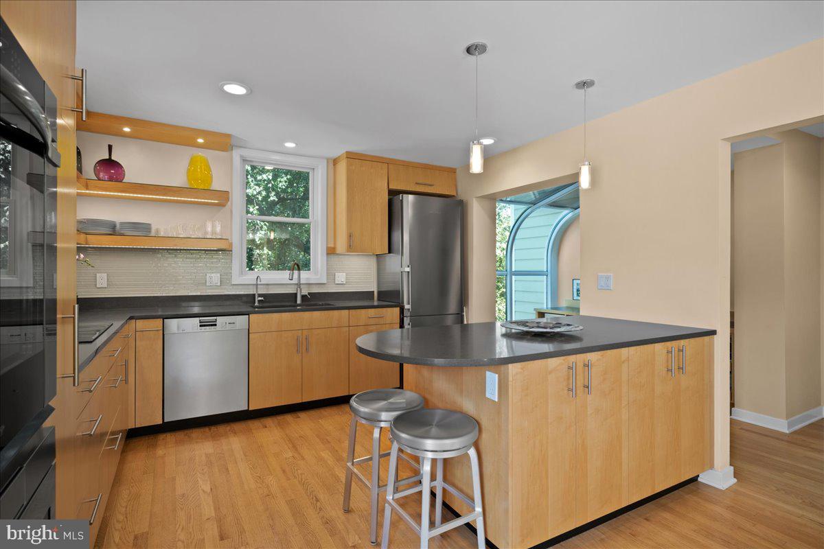 60 Humbert Street Princeton, NJ 08542 - Photo 17 of 44 a kitchen with kitchen island granite countertop a stove and a sink