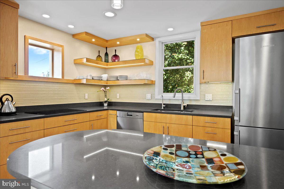 60 Humbert Street Princeton, NJ 08542 - Photo 19 of 44 a kitchen with stainless steel appliances granite countertop a sink and a refrigerator