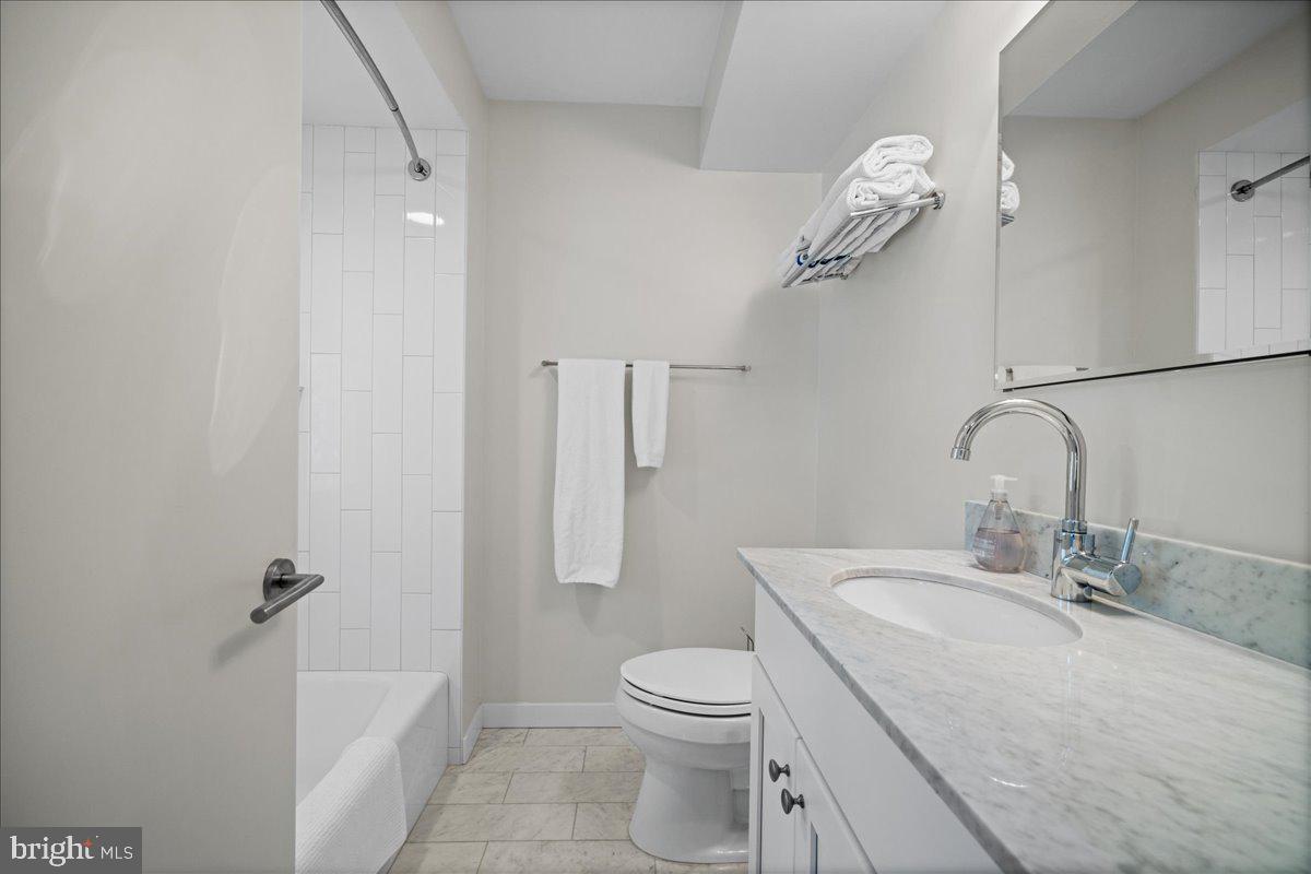 60 Humbert Street Princeton, NJ 08542 - Photo 28 of 44 a bathroom with a granite countertop sink toilet and shower