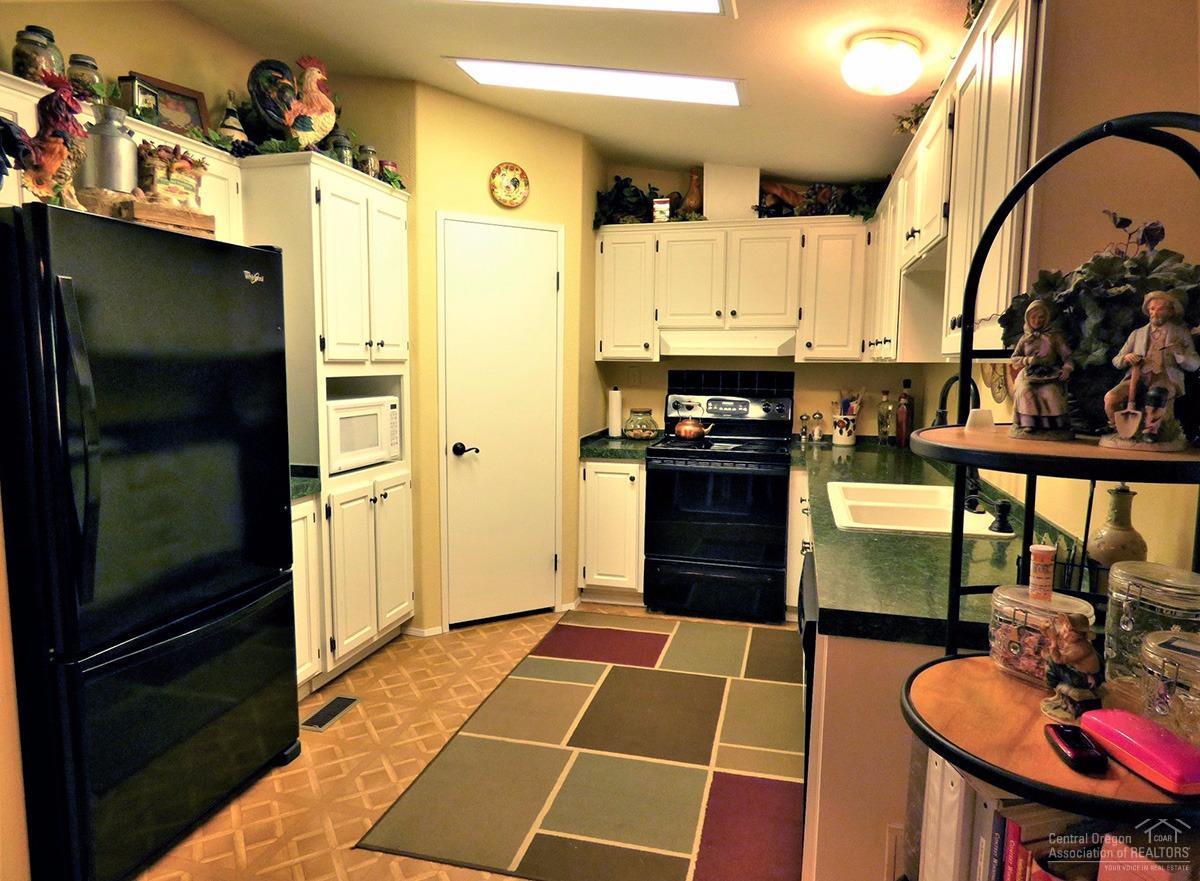 19176 Baker Road Bend, OR 97702 - Photo 8 of 25 a room with stainless steel appliances furniture a kitchen view and a refrigerator