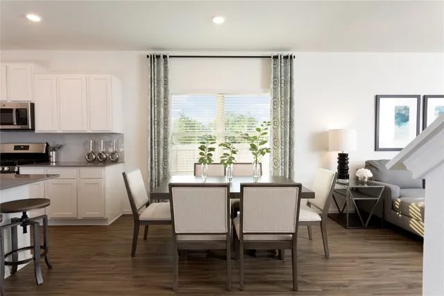 a kitchen with stainless steel appliances kitchen island granite countertop a sink and cabinets