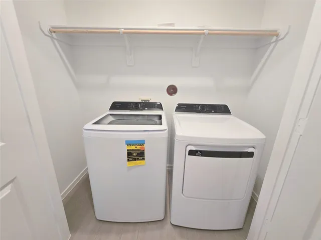a utility room with dryer and washer