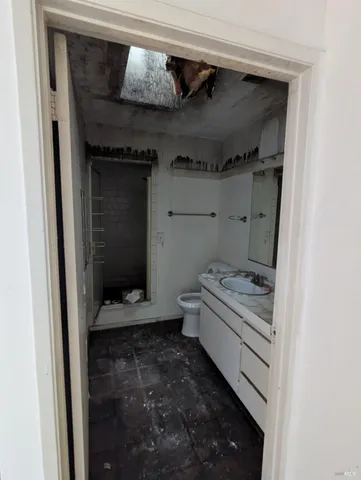 a bedroom with a bed and a fireplace