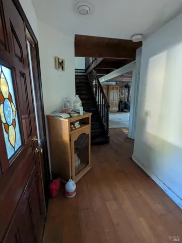 a view of a room with wooden floor and air conditioner