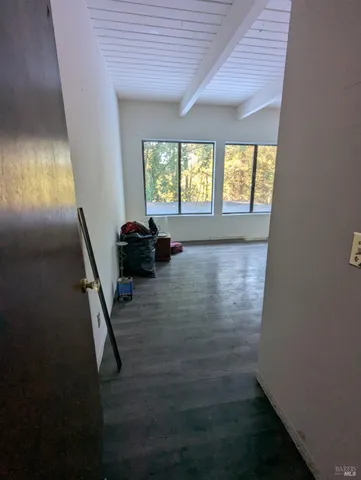 a white toilet sitting next to a small bathroom