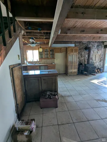 a kitchen with a refrigerator and cabinets
