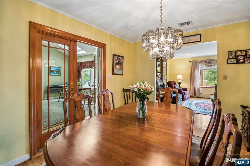 6 Waters Edge Butler, NJ 07405 - Photo 8 of 28 a view of a dining room with furniture window and wooden floor