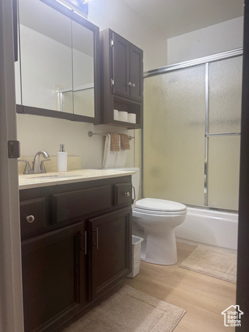 527 Palisade Drive Moab, UT 84532 - Photo 18 of 51 Bathroom featuring vanity, LVP finished floors, and shower / bath combination with glass door