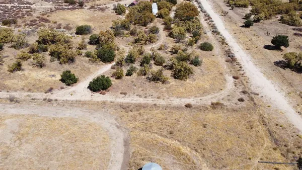 an aerial view of house with yard
