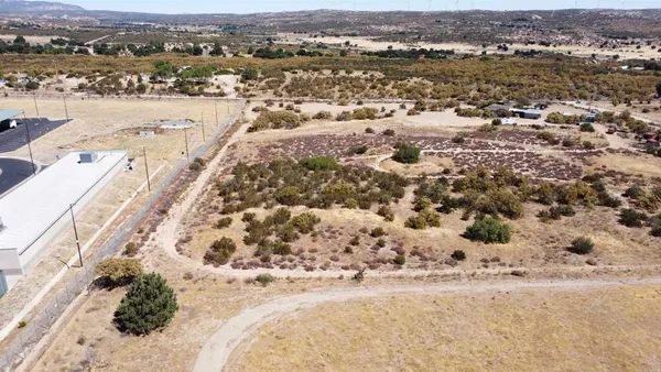 an aerial view of house with yard