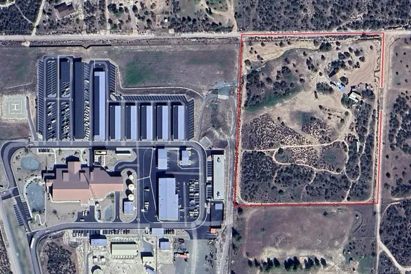 an aerial view of a house with beach and ocean view