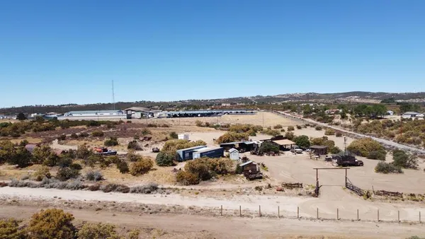 an aerial view of residential house with ocean view