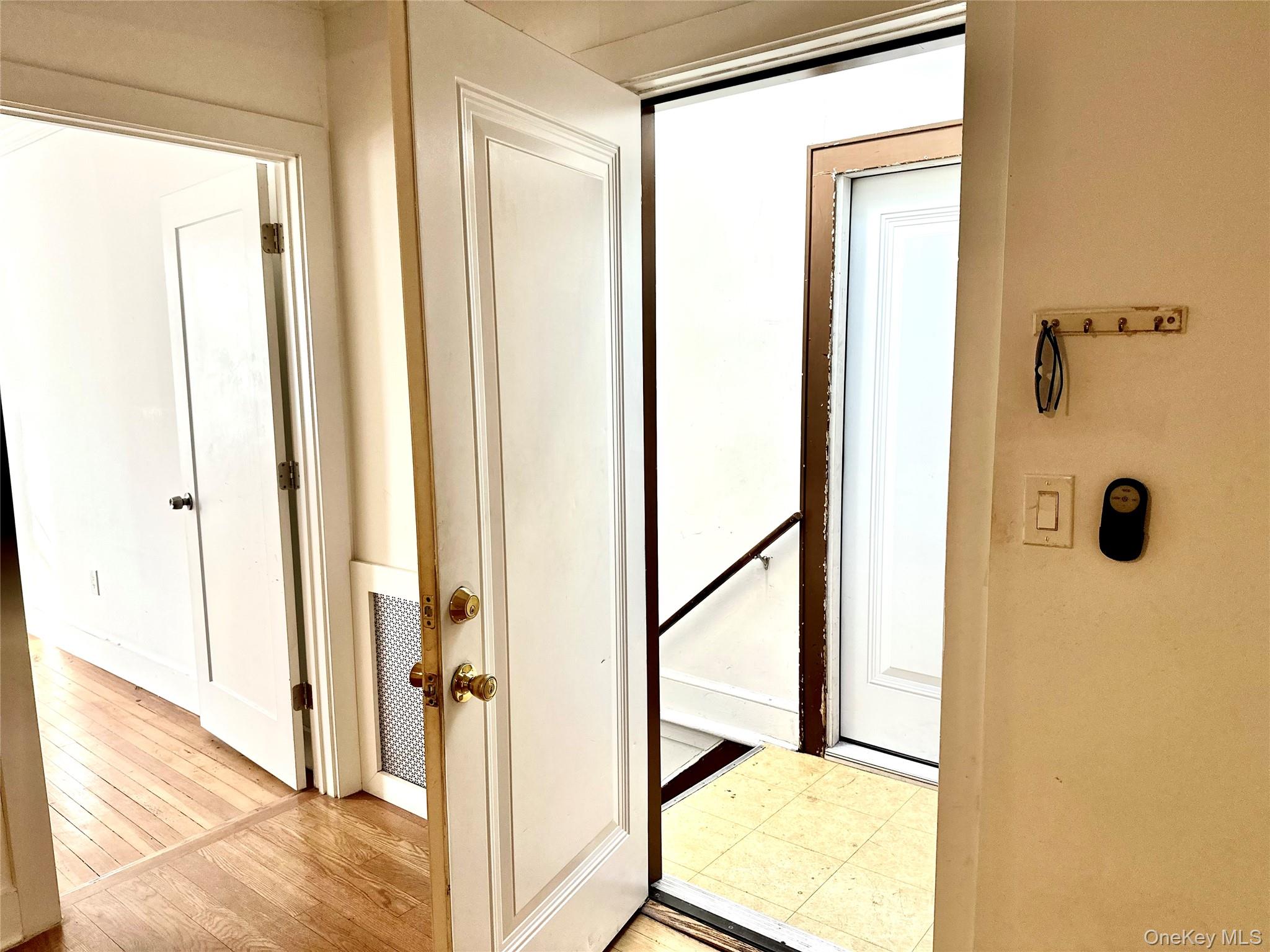 232 Fifth Avenue, Unit S (RIGHT SIDE) Pelham, NY 10803 - Photo 11 of 17 Standing in living room looking into the stairway.