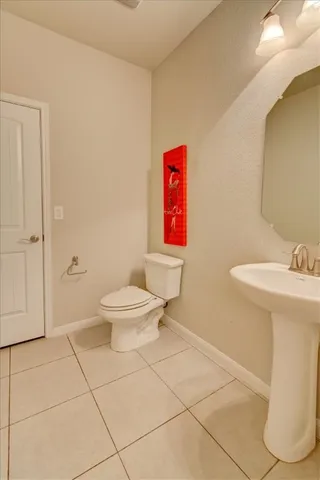 a bathroom with a toilet sink and shower