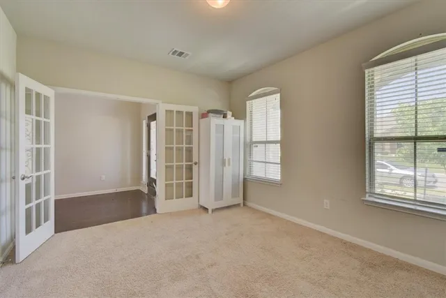 an empty room with windows