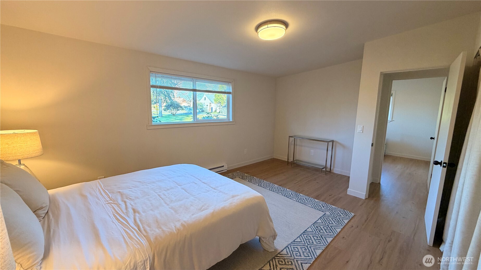630 7th Avenue Forks, WA 98331 - Photo 23 of 39 a bedroom with a bed and wooden floor