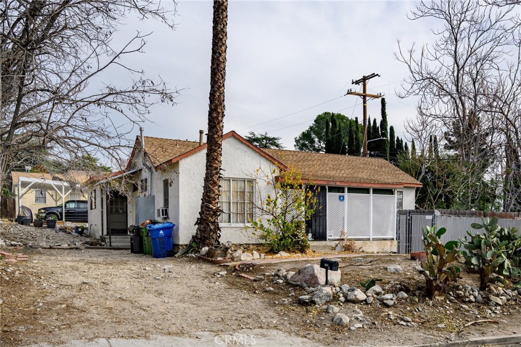 7025 Day Street Tujunga, CA 91042 - Photo 16 of 28 a front view of a house with garden