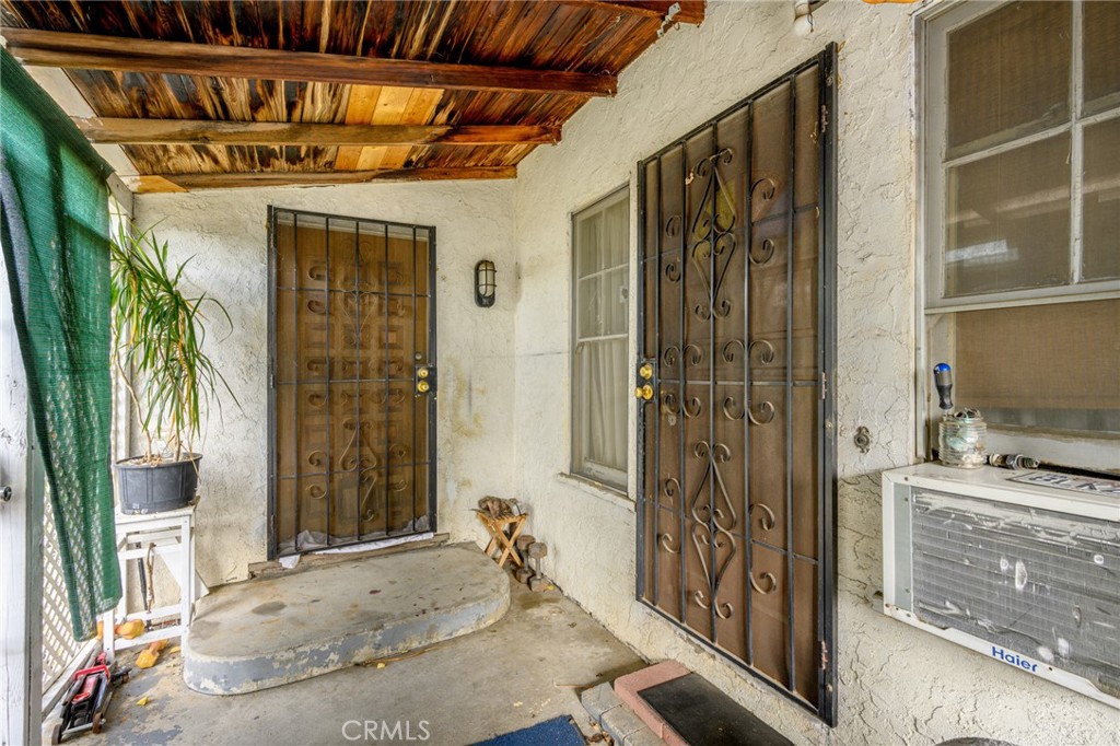7025 Day Street Tujunga, CA 91042 - Photo 20 of 37 a view of a porch with a table and chairs