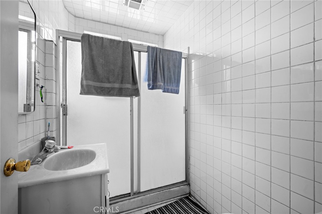 7025 Day Street Tujunga, CA 91042 - Photo 26 of 37 a bathroom with a sink and mirror