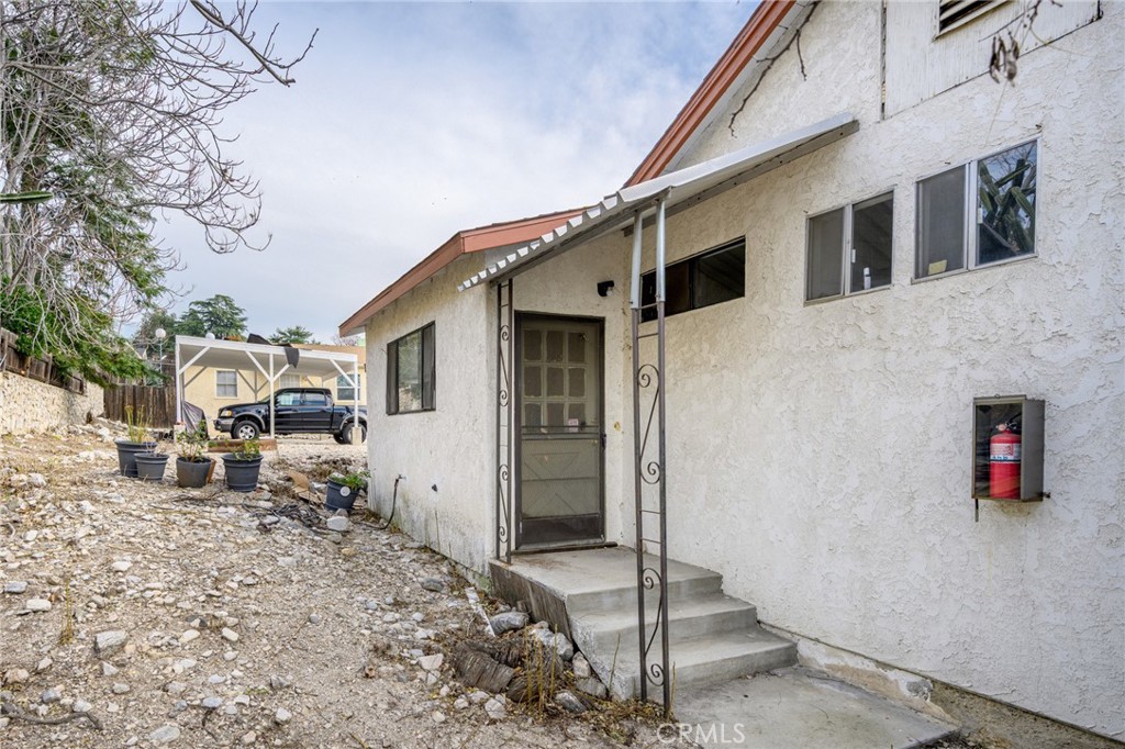 7025 Day Street Tujunga, CA 91042 - Photo 34 of 36 a front view of a house with a yard