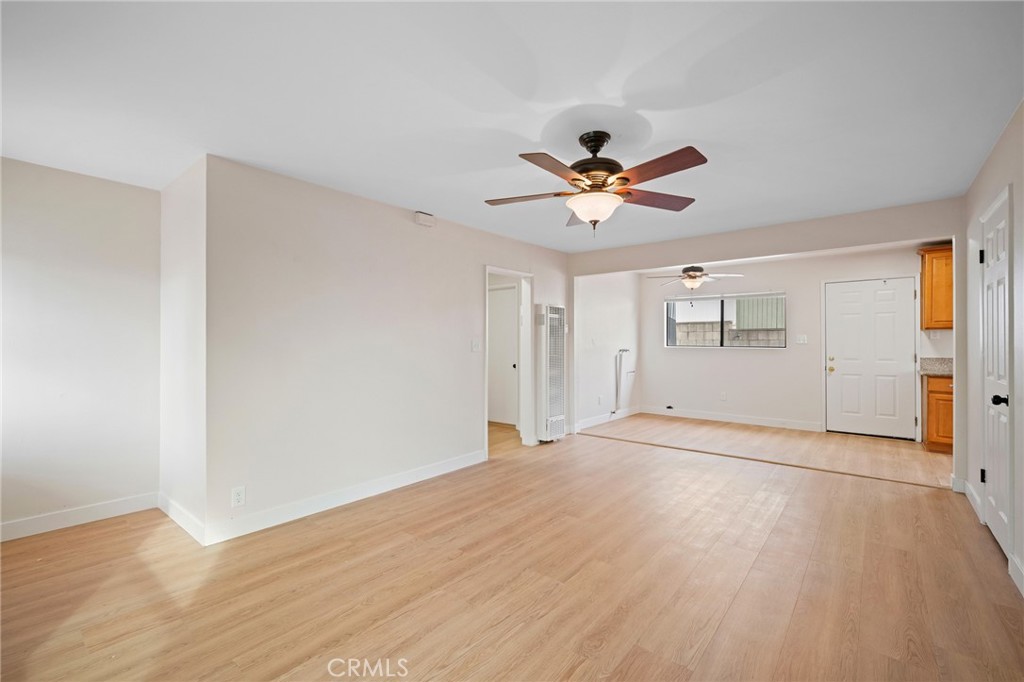 7025 Day Street Tujunga, CA 91042 - Photo 4 of 28 a view of a big room with wooden floor and a chandelier fan