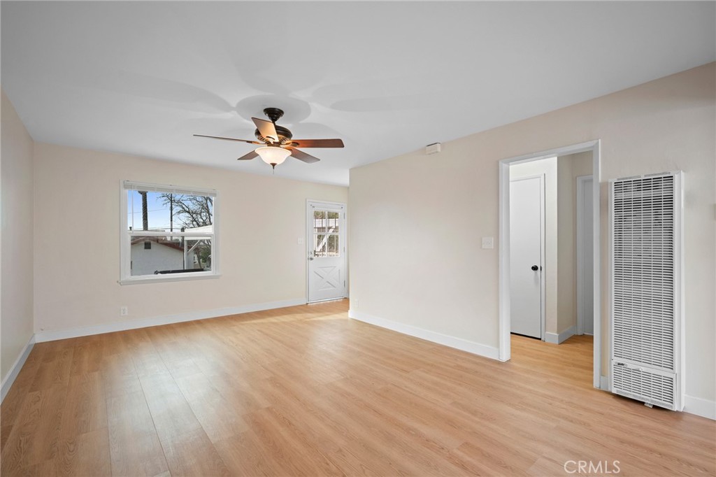 7025 Day Street Tujunga, CA 91042 - Photo 5 of 28 wooden floor in an empty room with a window