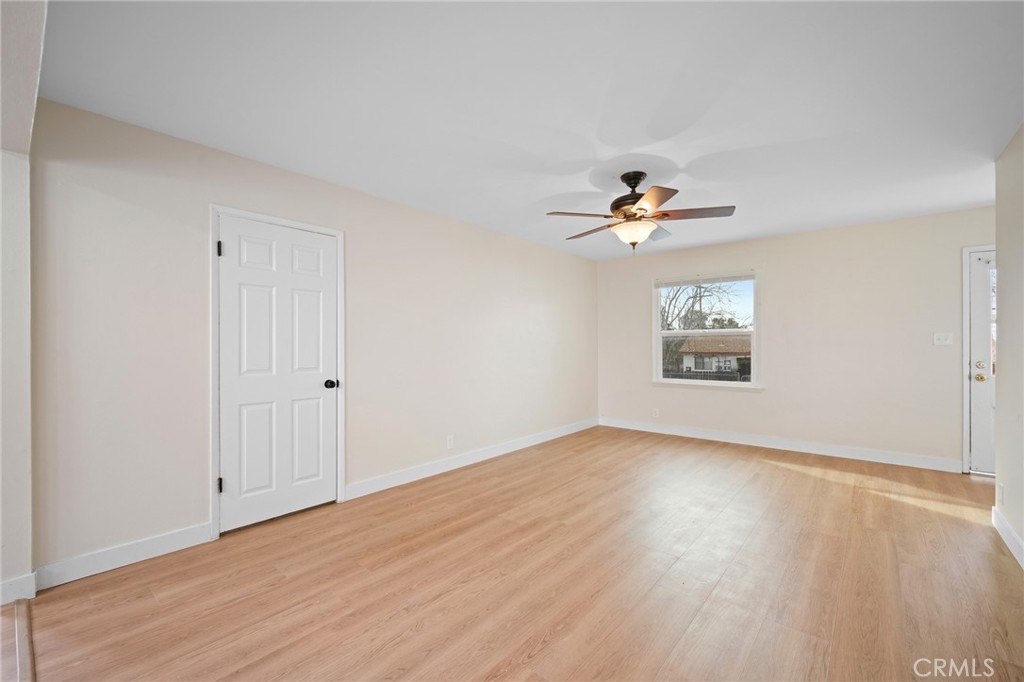 7025 Day Street Tujunga, CA 91042 - Photo 6 of 28 wooden floor in an empty room with a window